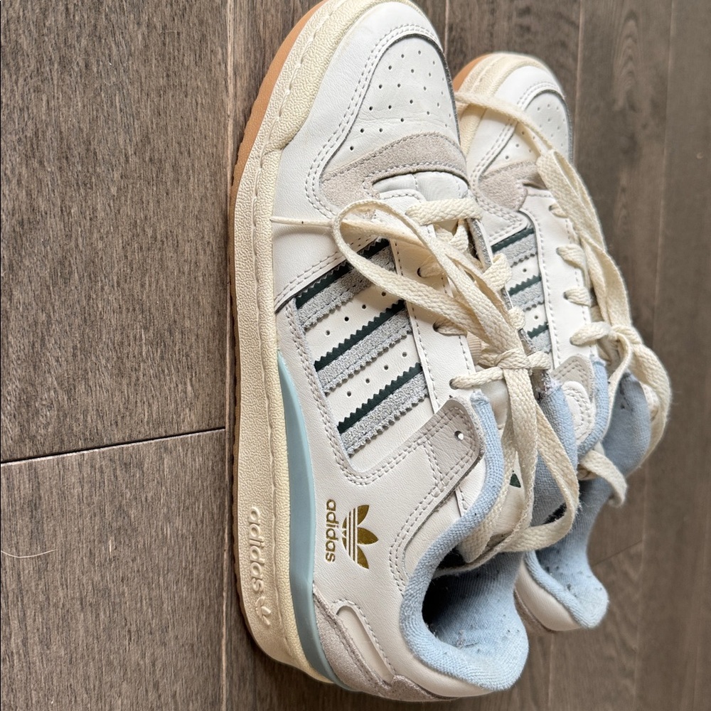 Adidas club Forum with  Baby Blue and Gold Accents. Women’s size 6.5